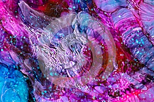 Resin art paint with red, blue and white colors. Liquid backdrop with splashes and ripples. Modern abstract artwork with