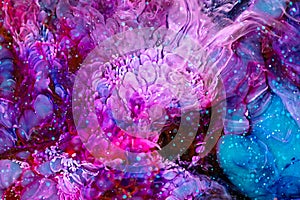 Resin art texture with pink, turquoise and red colors. Liquid background with splashes and swirls. Modern abstract