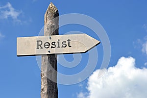 Resist - wooden signpost with one arrow