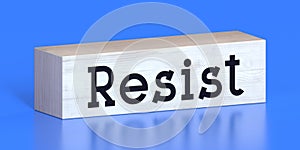 Resist - word on wooden block