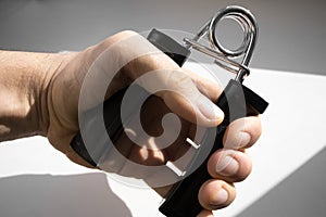 Resistance band for hand exercise on a white background