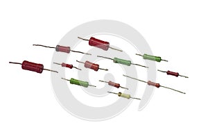 Resistor set: multicolored cylindrical vintage electronic components with leads for through hole mounting, neatly lay out in rows