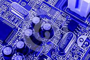 Resistors, capacitors and other electronic components of micro chip inside the computer close up