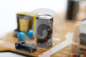 Resistors, capacitors and other electronic components of micro chip inside the computer close up