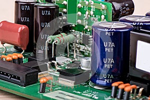 Resistors, capacitors and other electronic components of micro chip inside the computer close up.