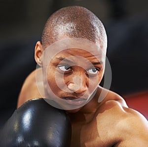 Resolved to be the best. A young boxer with determination and focus in his eyes.