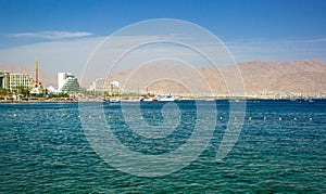 Resort harbor city luxury waterfront beaches coast line with hotels and apartments buildings along Gulf of Aqaba Red sea bay,