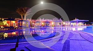 Resort hotel pool and patio at night