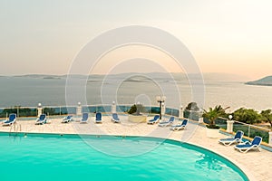 Resort swimming pool at sunset