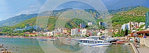 Resort town on the coast of Montenegro. Cove with boats on the Adriatic Sea, a small tourist town with beaches. Tourist trips, photo