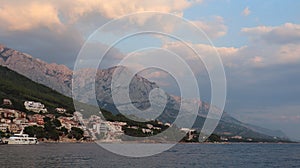 The resort village Brela, Croatia on the Adriatic Sea, view from the sea on a summer evening