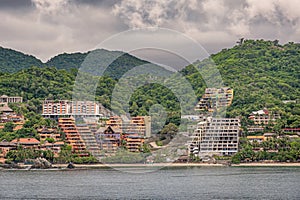 Resorts build in terraces up the hill, Zihuatanejo, Mexico photo