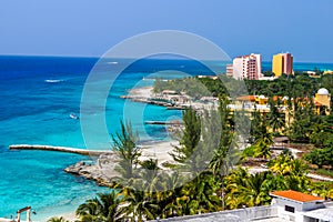 Resorts dot shoreline on Caribbean island photo