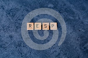 `RESP` Registered Education Savings Plan spelled out in wooden letter tiles