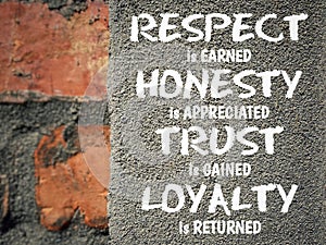 Respect is earned honesty is appreciated trust is gained loyalty is returned written on concrete. Inspirational quote concept. photo