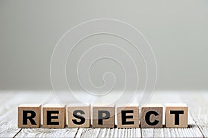 Respect word written on wood block