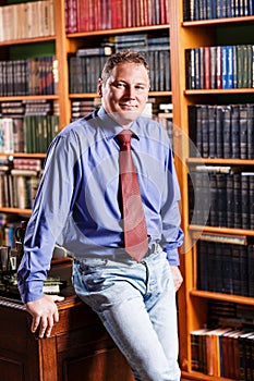 Respectable man leaned on the table