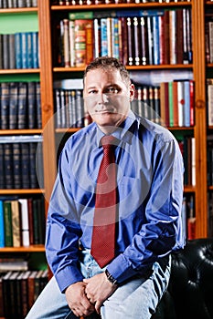 Respectable man leaned on the table