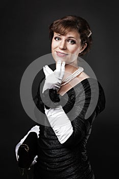 Respectable woman in white gloves photo