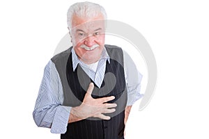 Respectful senior man with hand on chest