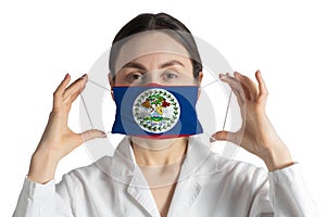 Respirator with flag of Belize Doctor puts on medical face mask isolated on white background