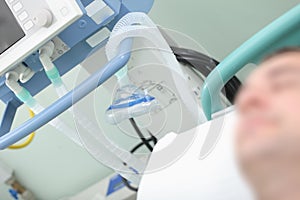 Respiratory equipment on the background of sleeping patient in t