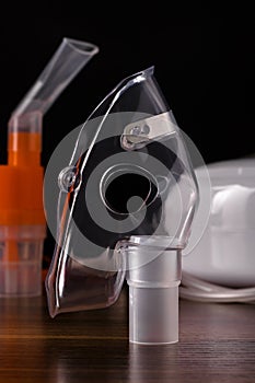 Respiratory mask for compressor nebulizer on table, close up
