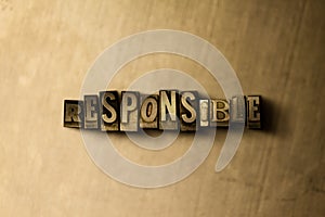 RESPONSIBLE - close-up of grungy vintage typeset word on metal backdrop