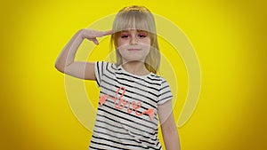 Responsible teen child kid girl giving salute listening to order as if soldier, following discipline