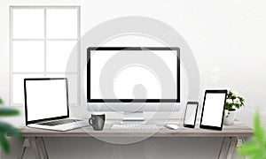 Responsive devices on desk with screen for mockup