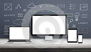 Responsive web design mockup with computer display, laptop, tablet and smart phone.