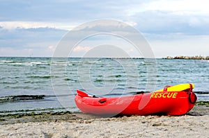 Resque  red  lifeguard kayak.