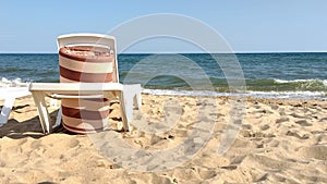 Rest on the beautiful sunny Black Sea coast. Sun loungers on the beach overlooking the beautiful sea waves. Mobile video