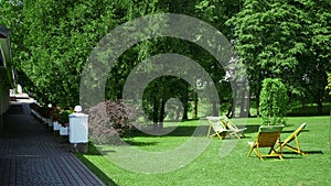 Rest chairs in the garden. Resort concept