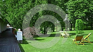 Rest chairs in the garden. Resort concept