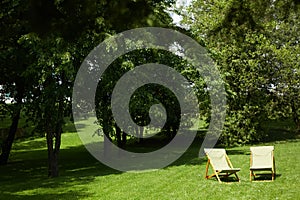 Rest chairs in the garden. Resort concept