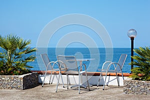 Rest on coast. Table and chairs on beach