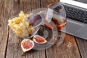 Rest in the evening after work a glass of cognac with fruit near