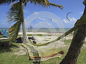 Hammock Rest in hammock. Kitesurf in Caribbean sea.