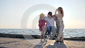 Rest, Invalid With wife and daughter in backlight, dad, child and mother hugging each other, joyful family on background