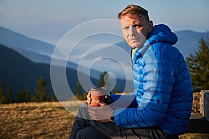 Rest of lonely guy outdoors in the mountains.