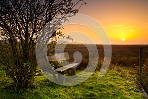 Rest place with bench at sunrise