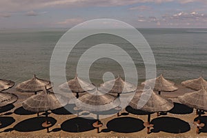 Rest by the sea on the beach with the same umbrellas.