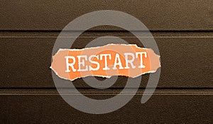 Restart and start symbol. The concept word Restart on wooden circles. Beautiful blue background, copy space.