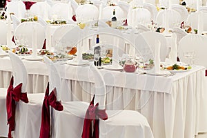 A restaurant banquet room decorated for a wedding