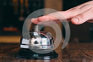 Restaurant bell vintage with hand. Hotel service bell