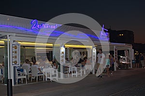 Restaurant with blue neon sign