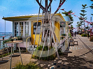 the restaurant building is on the seafront, the food served is Indonesian specialties