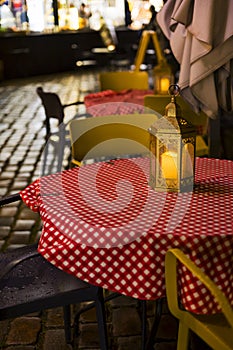 a restaurant or cafe. Tables and chairs in the outdoor restaurant. There are no visitors at the restaurant for dinner.