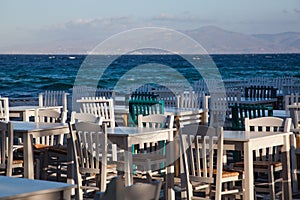 restaurant chairs and tables by the sea